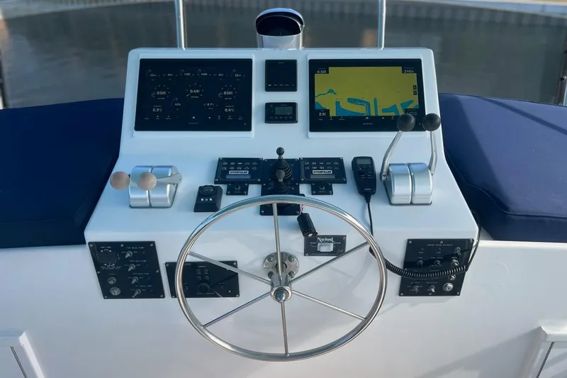 Long Tail Yacht Photos Pics 1985 Hatteras 58 Motor Yacht helm with navigation screens and controls.