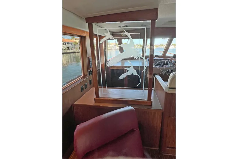 Long Tail Yacht Photos Pics Interior of 1985 Hatteras 58 Motor Yacht with etched glass panel and wood accents.