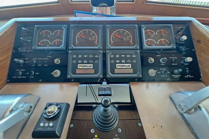 Long Tail Yacht Photos Pics Control panel of a 1985 Hatteras 58 Motor Yacht with gauges and switches.
