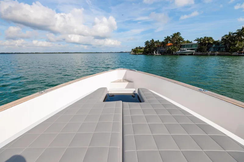 The Wolf Yacht Photos Pics Pardo Yachts 38, 2021 model, cruising on serene waters with luxurious deck seating.