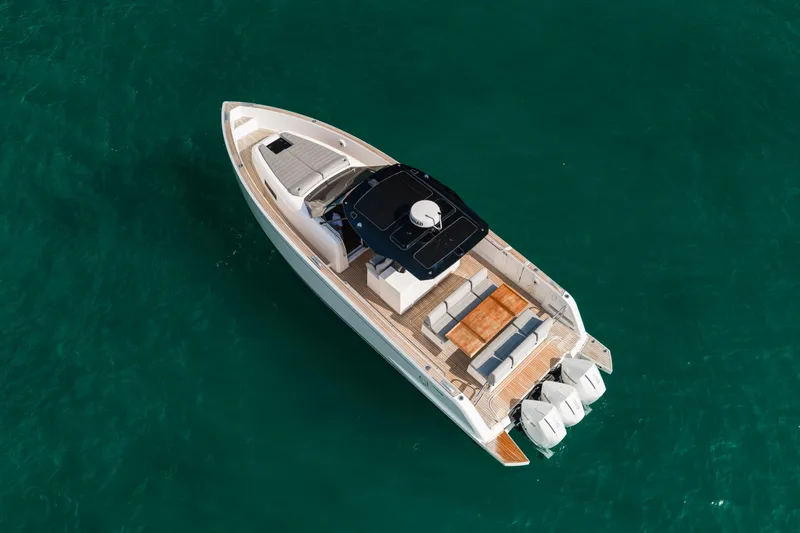The Wolf Yacht Photos Pics Aerial view of 2021 Pardo Yachts 38 on turquoise water.