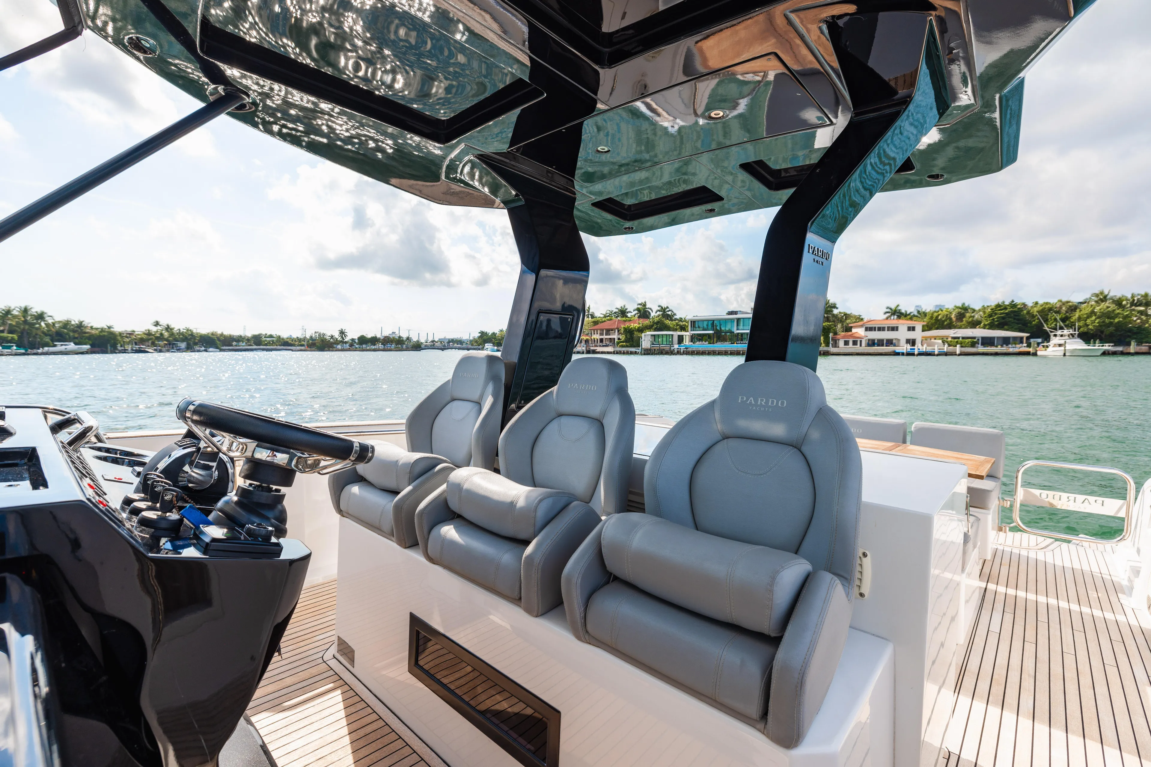 The Wolf Yacht Photos Pics Luxury seating on 2021 Pardo Yachts 38, featuring sleek design and waterfront view.