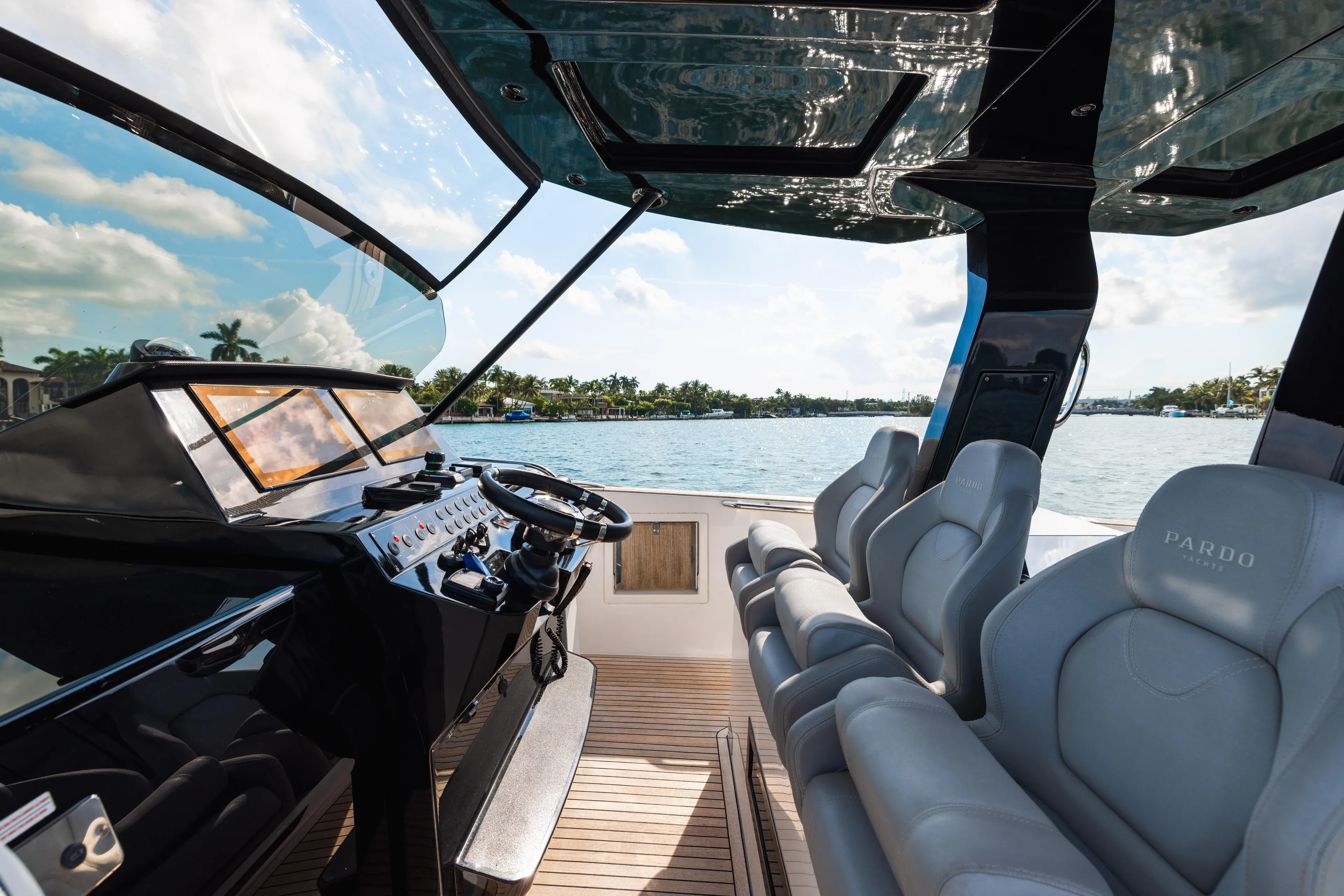 The Wolf Yacht Photos Pics Interior view of 2021 Pardo Yachts 38, featuring sleek helm and luxurious seating.