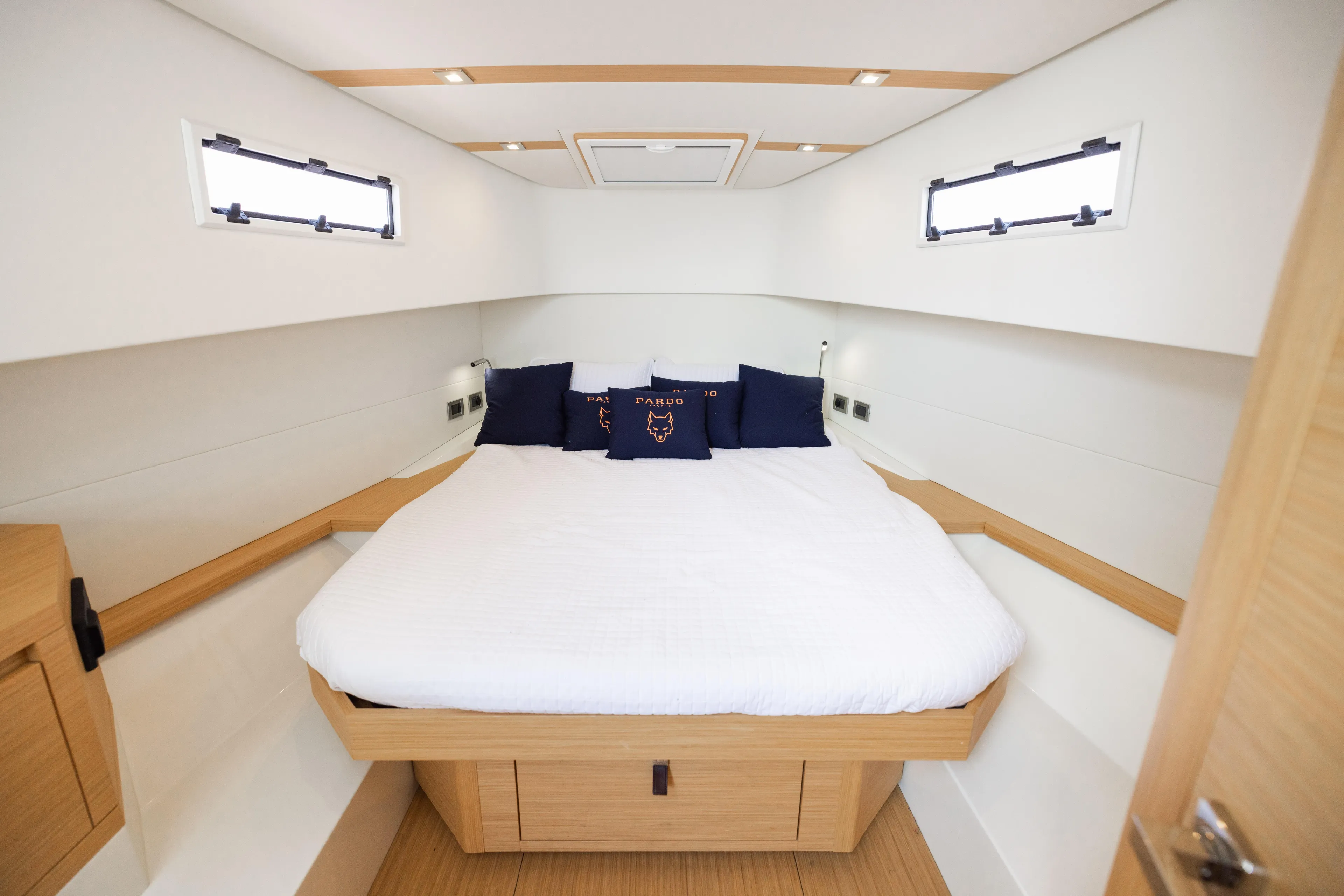 The Wolf Yacht Photos Pics Luxurious cabin interior of 2021 Pardo Yachts 38 with elegant bedding and modern design.