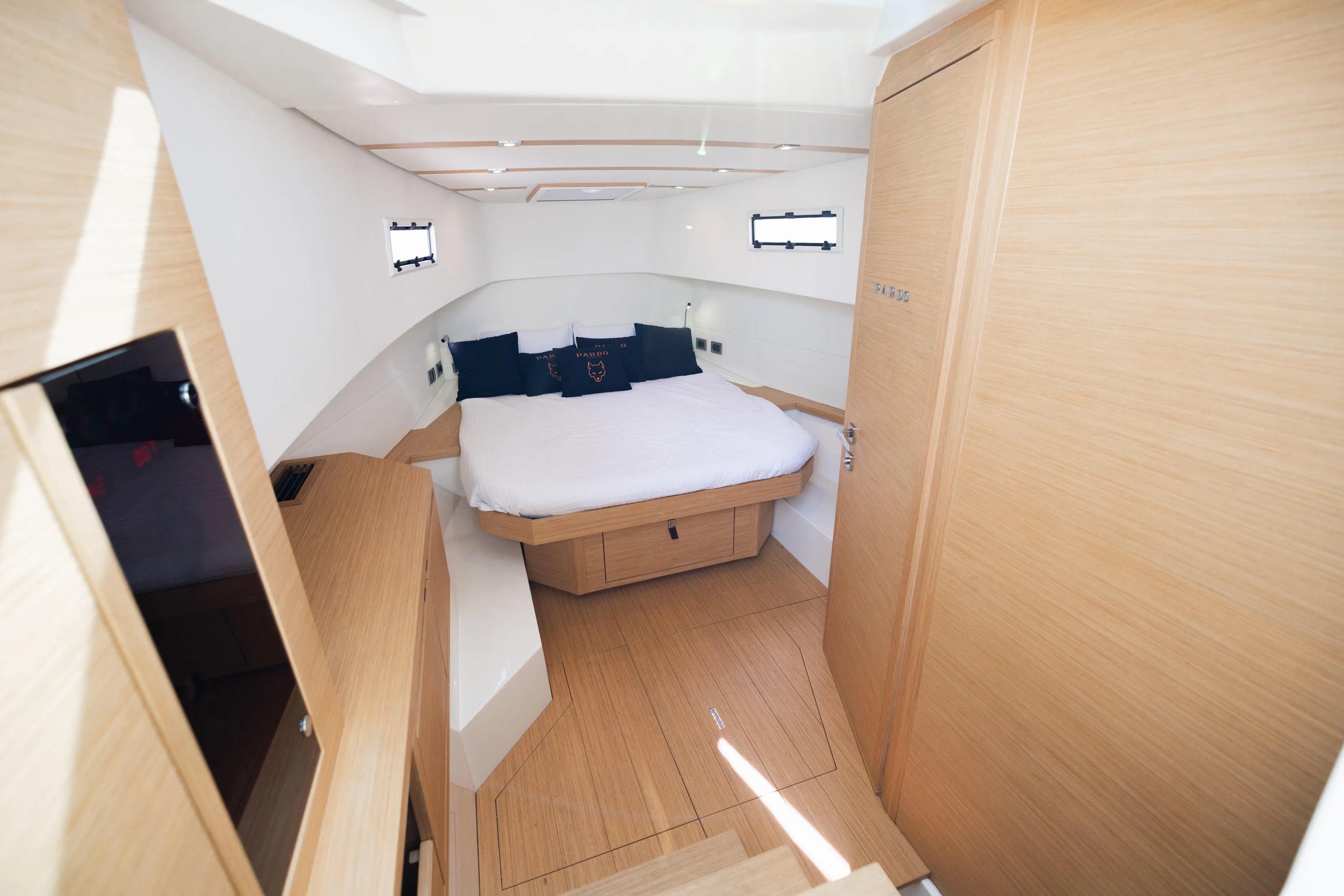 The Wolf Yacht Photos Pics Luxurious cabin interior of 2021 Pardo Yachts 38 with modern wood finish.