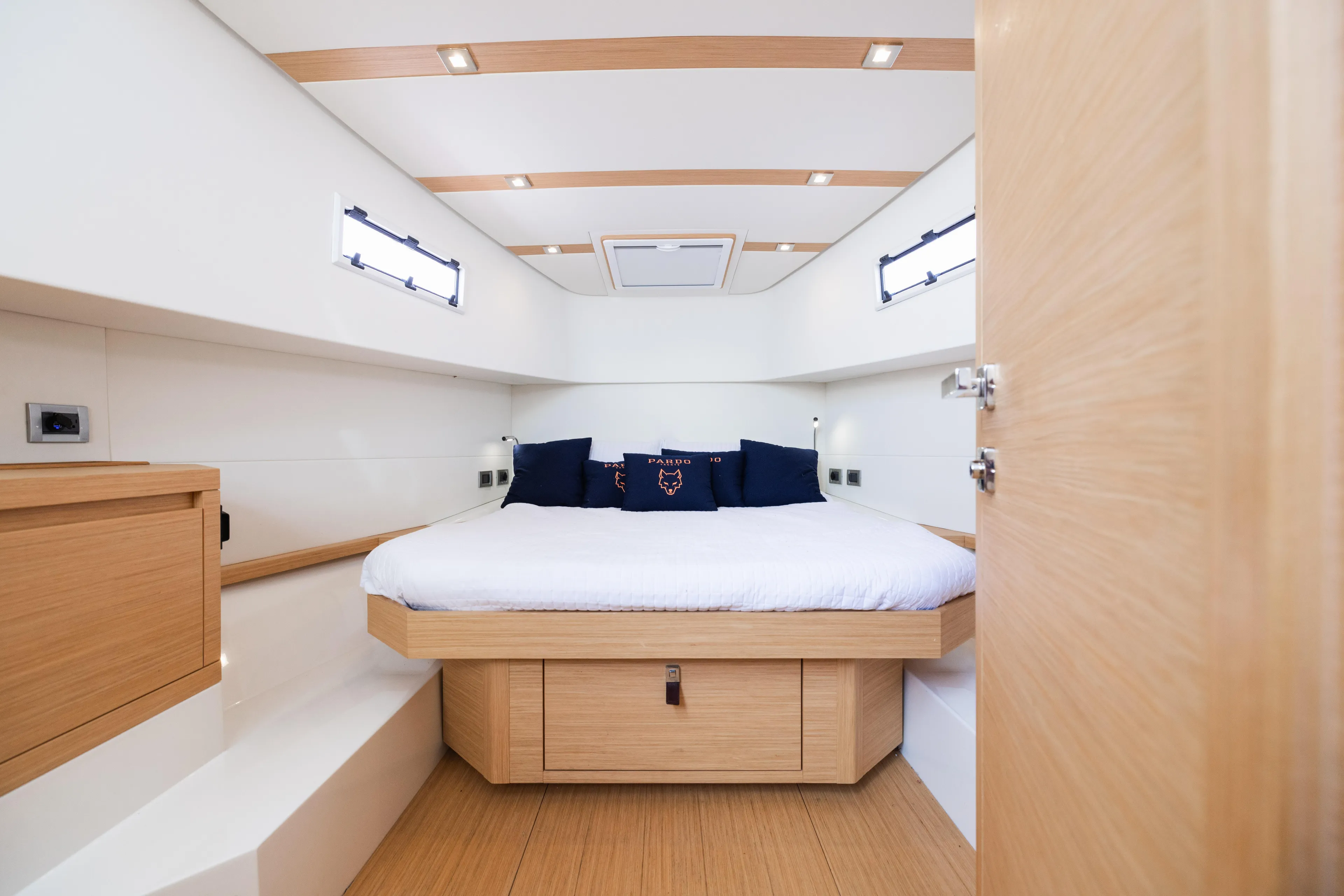 The Wolf Yacht Photos Pics Luxurious cabin interior of 2021 Pardo Yachts 38 with modern wood finish.