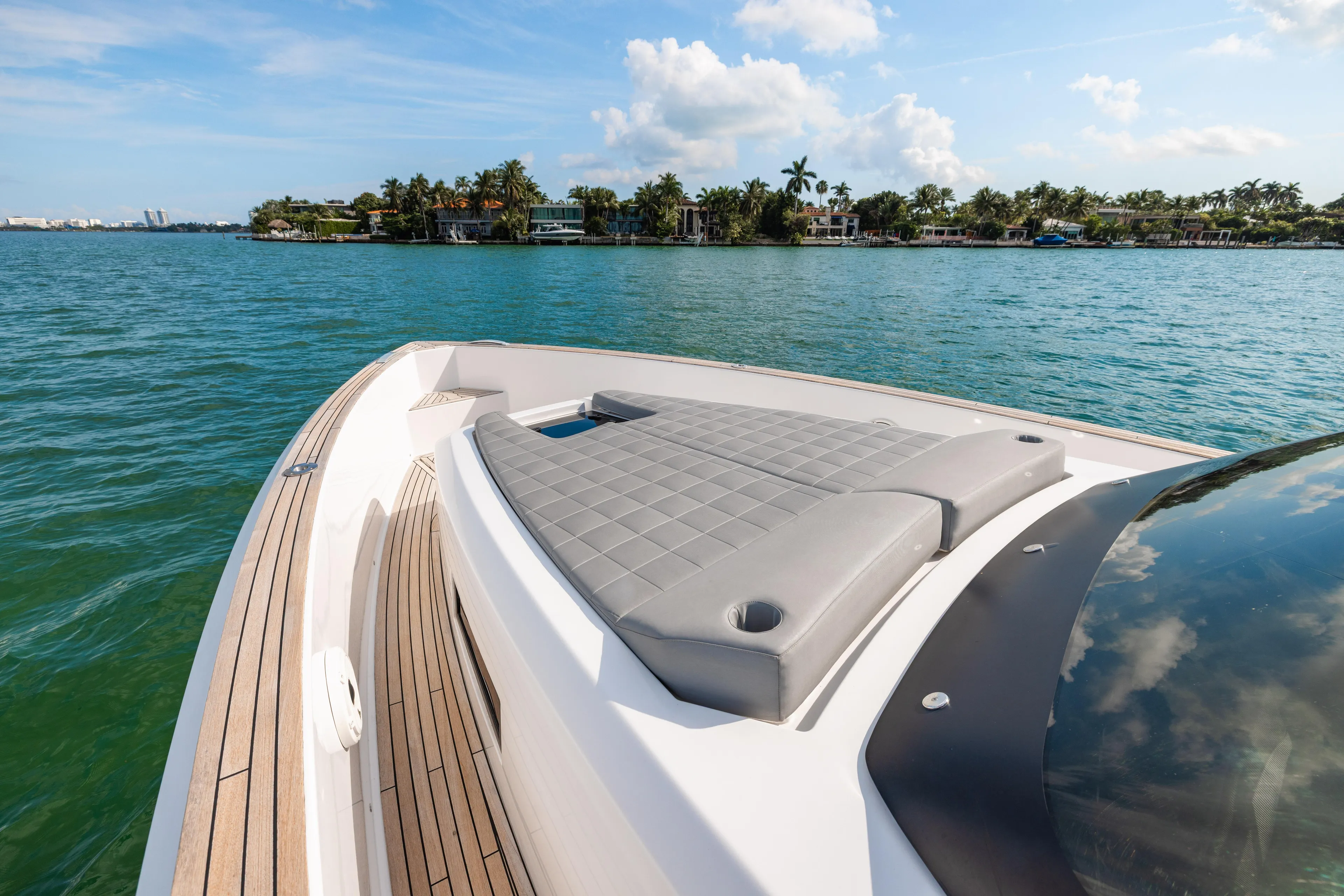 The Wolf Yacht Photos Pics 2021 Pardo Yachts 38 on serene water, featuring sleek deck and luxurious seating.