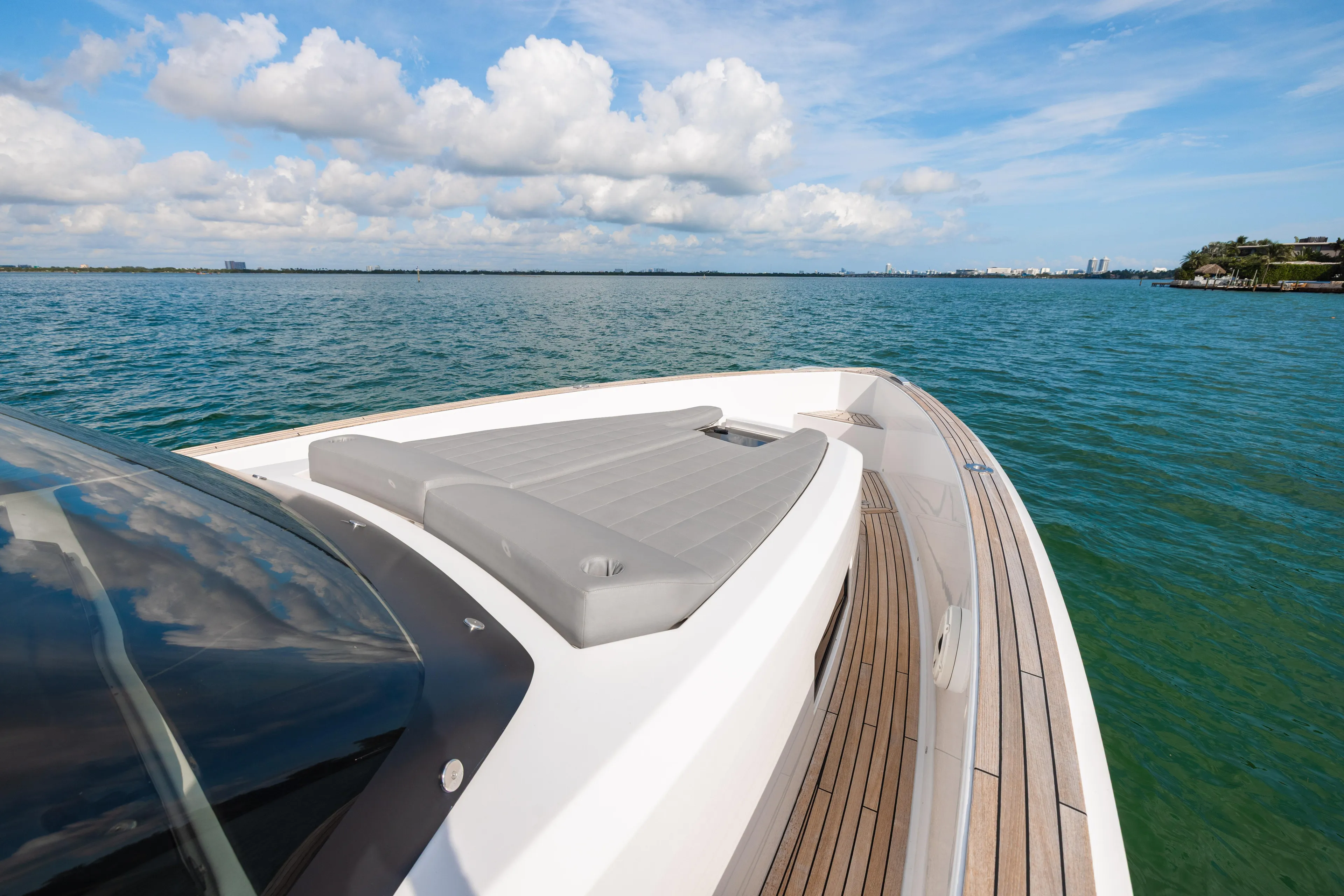 The Wolf Yacht Photos Pics 2021 Pardo Yachts 38 on serene blue water under a partly cloudy sky.