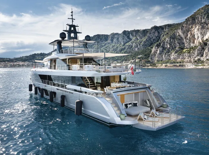 Ocean One Yacht Photos Pics Luxurious 2023 Azimut Grande 36M yacht cruising near rocky coastline.