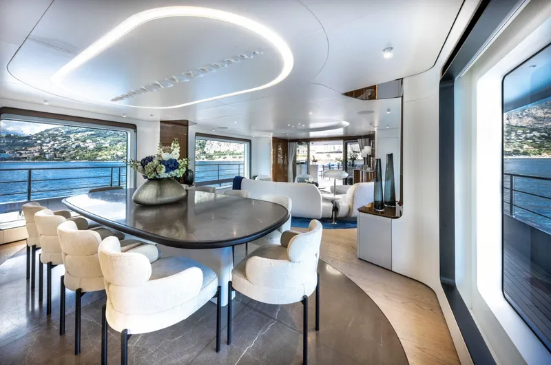 Ocean One Yacht Photos Pics Luxurious interior of 2023 Azimut Grande 36M yacht with elegant dining area and scenic ocean views.