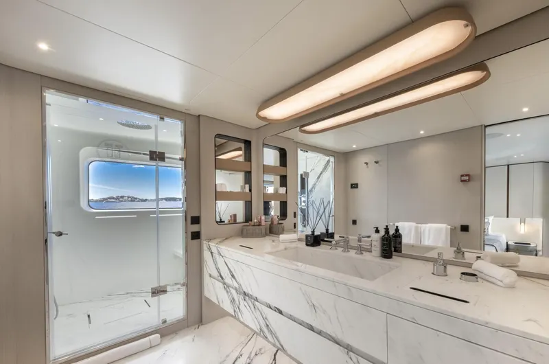 Ocean One Yacht Photos Pics Luxurious bathroom in 2023 Azimut Grande 36M yacht with marble finishes and modern fixtures.