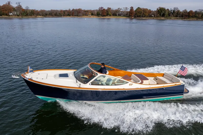 Ballymena Yacht Photos Pics 2006 Hinckley Talaria 29 R cruising on a calm lake with American flag.