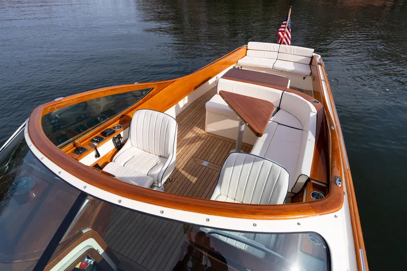 Ballymena Yacht Photos Pics 2006 Hinckley Talaria 29 R boat with elegant seating and wooden accents on calm water.