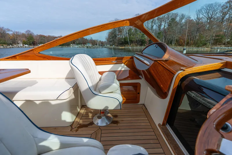 Ballymena Yacht Photos Pics 2006 Hinckley Talaria 29 R interior with elegant wood finish and white seating.