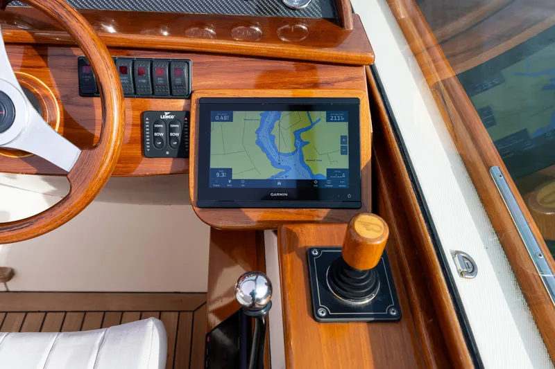 Ballymena Yacht Photos Pics 2006 Hinckley Talaria 29 R dashboard with Garmin navigation and wooden steering wheel.