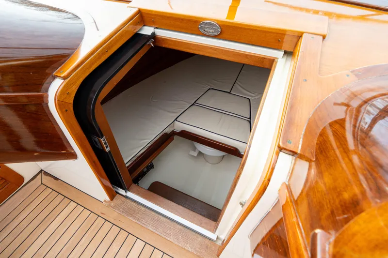 Ballymena Yacht Photos Pics 2006 Hinckley Talaria 29 R cabin interior with wooden finish and compact seating.