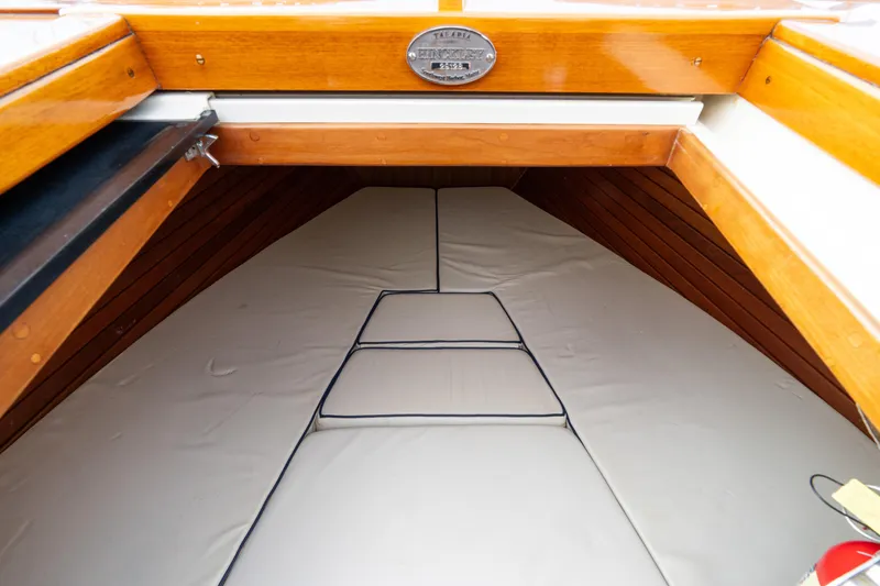 Ballymena Yacht Photos Pics 2006 Hinckley Talaria 29 R cabin interior with wooden trim and cushioned seating.