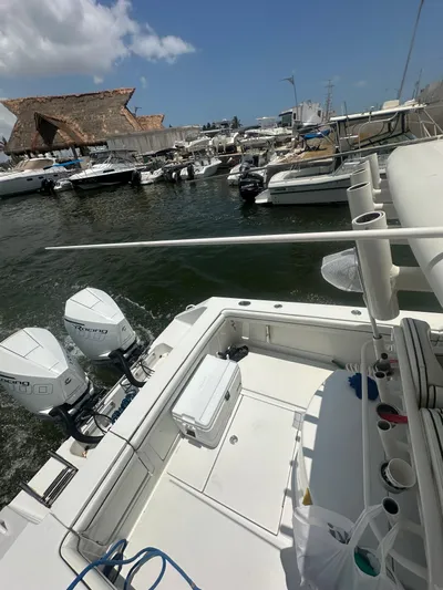  Yacht Photos Pics 2014 Jupiter 30 HSF boat docked in a marina with other vessels.