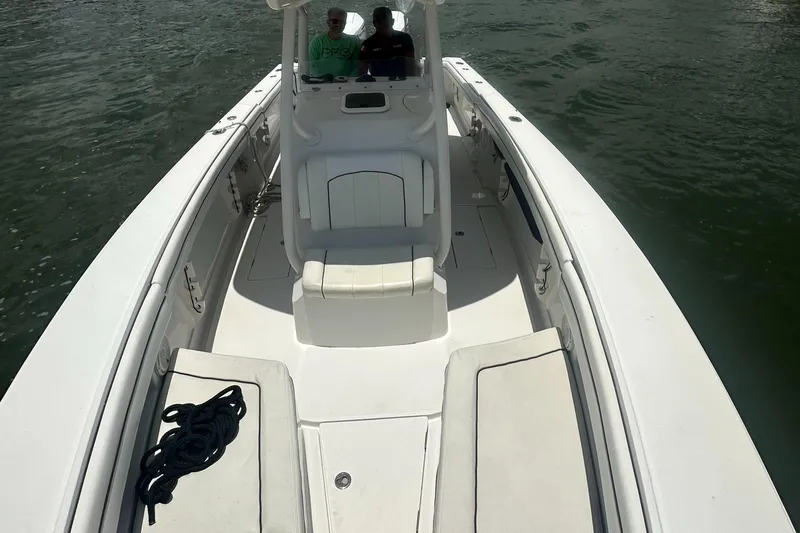  Yacht Photos Pics 2014 Jupiter 30 HSF boat on water, featuring spacious deck and seating.