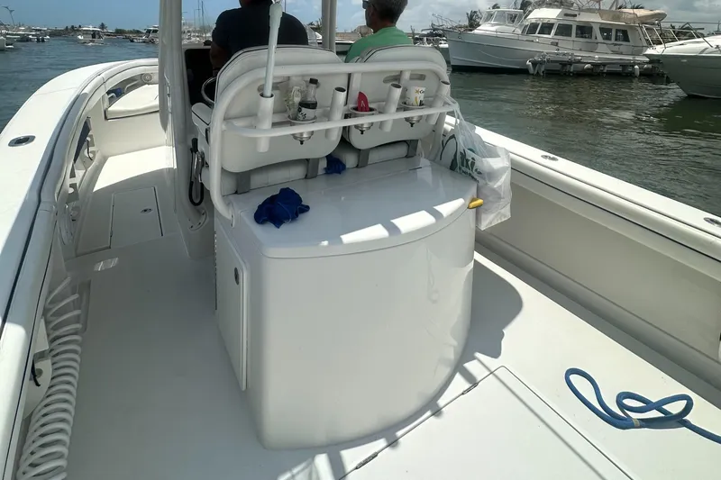  Yacht Photos Pics 2014 Jupiter 30 HSF boat interior with seating, docked in a marina.