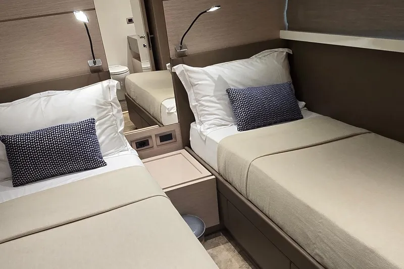  Yacht Photos Pics Luxurious twin cabin interior on 2021 Sanlorenzo SL78 yacht, featuring modern design and cozy bedding.