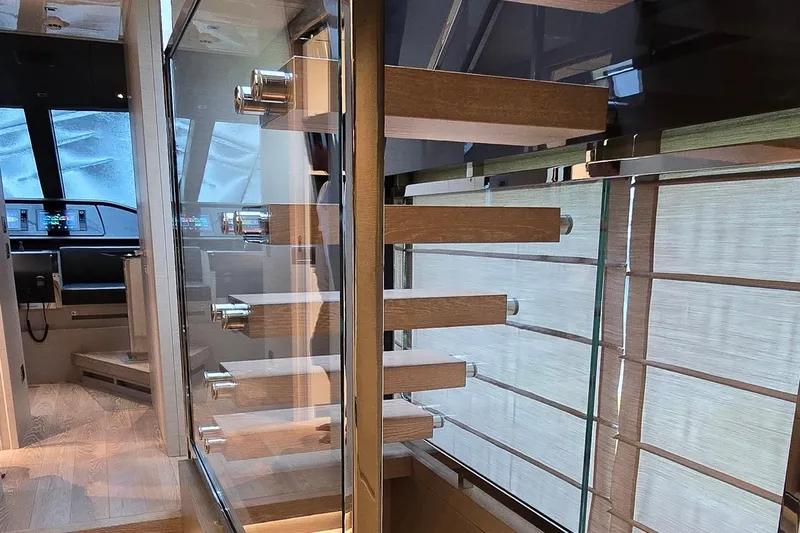  Yacht Photos Pics Modern interior of 2021 Sanlorenzo SL78 yacht with sleek wooden staircase design.