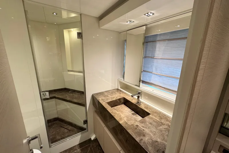  Yacht Photos Pics Luxurious bathroom in 2021 Sanlorenzo SL78 yacht with marble countertop and modern fixtures.