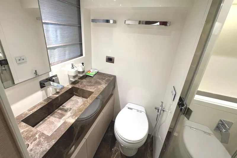  Yacht Photos Pics Luxurious bathroom in 2021 Sanlorenzo SL78 yacht with marble countertop and modern fixtures.