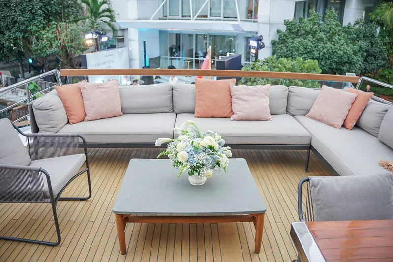  Yacht Photos Pics Luxurious Sanlorenzo SL78 yacht deck with elegant seating and floral centerpiece, 2021 model.