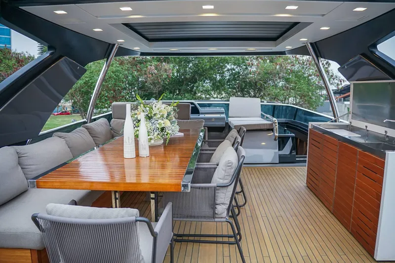  Yacht Photos Pics Luxurious 2021 Sanlorenzo SL78 yacht deck with dining area and modern amenities.