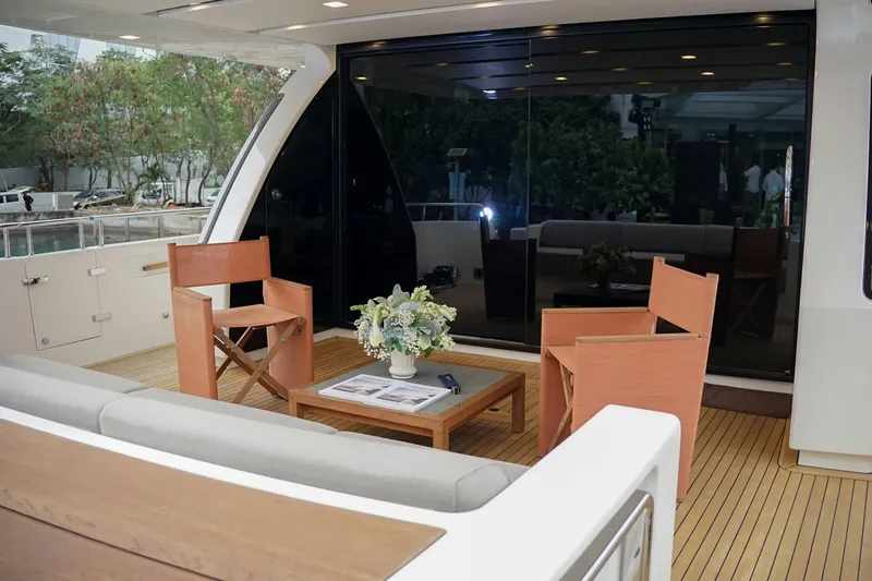  Yacht Photos Pics Luxurious 2021 Sanlorenzo SL78 yacht deck with elegant seating and floral centerpiece.