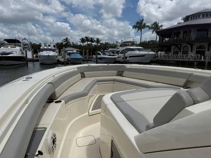  Yacht Photos Pics Luxurious 2022 Scout 425 LXF boat interior at marina with yachts and palm trees.
