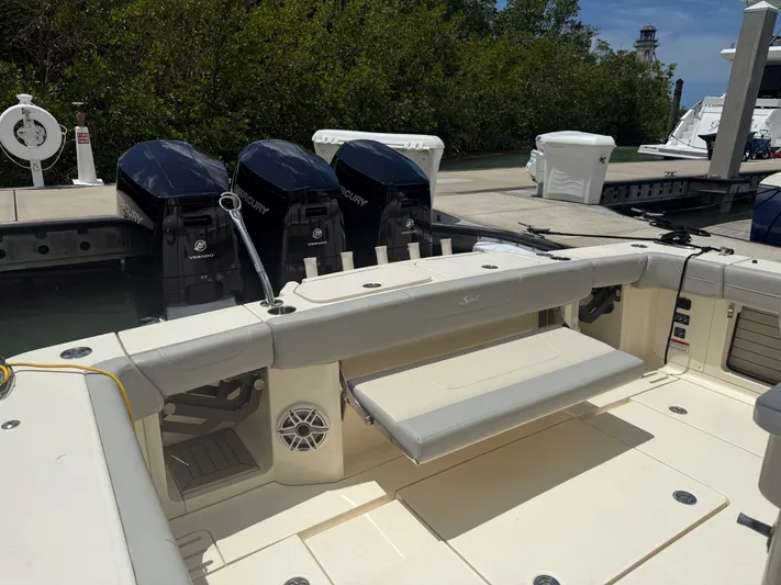  Yacht Photos Pics 2022 Scout 425 LXF boat with triple Mercury outboard engines docked at marina.