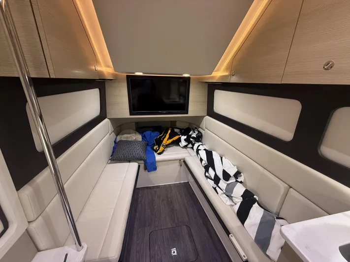  Yacht Photos Pics Luxurious interior of 2022 Scout 425 LXF boat with seating and TV.