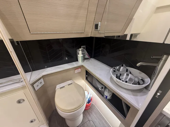  Yacht Photos Pics Modern bathroom in 2022 Scout 425 LXF boat with sleek fixtures and storage.