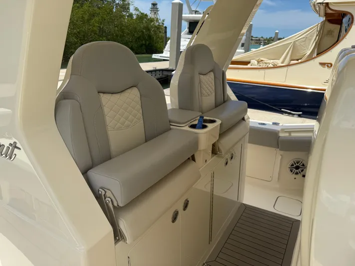  Yacht Photos Pics Luxury seating on 2022 Scout 425 LXF boat, featuring elegant design and comfort.