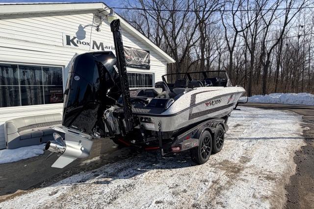 2026 Vexus DVX22 boat parked outside Knox Marine in snowy setting.
