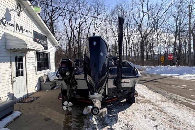 2026 Vexus DVX22 boat parked outside Knox Marine in snowy setting.