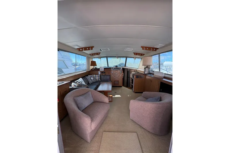 Sea Legs Yacht Photos Pics Interior of 1987 Bertram 46.6 yacht with cozy seating and helm view.