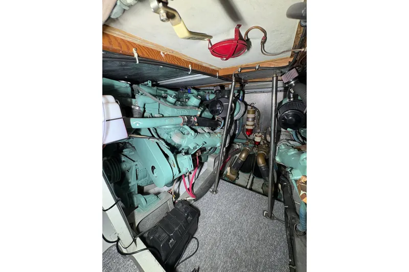 Sea Legs Yacht Photos Pics Engine room of a 1987 Bertram 46.6 yacht, showcasing mechanical components.