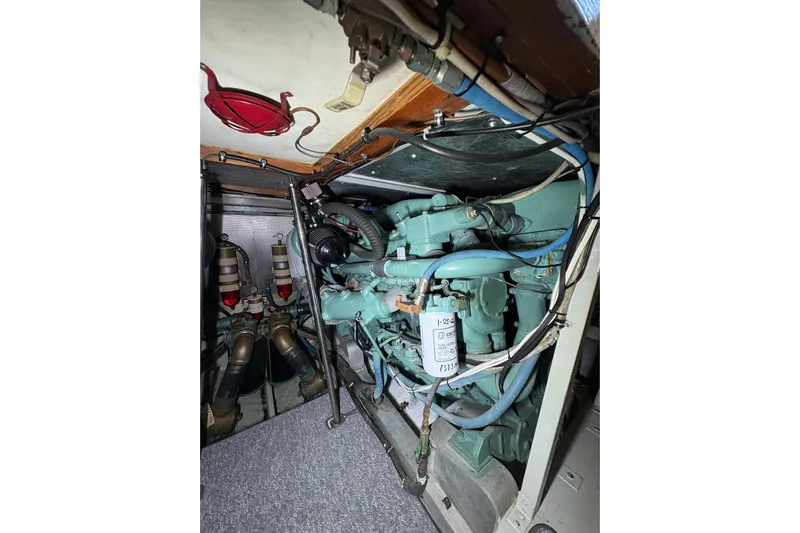 Sea Legs Yacht Photos Pics Engine room of a 1987 Bertram 46.6 yacht, showcasing mechanical components.