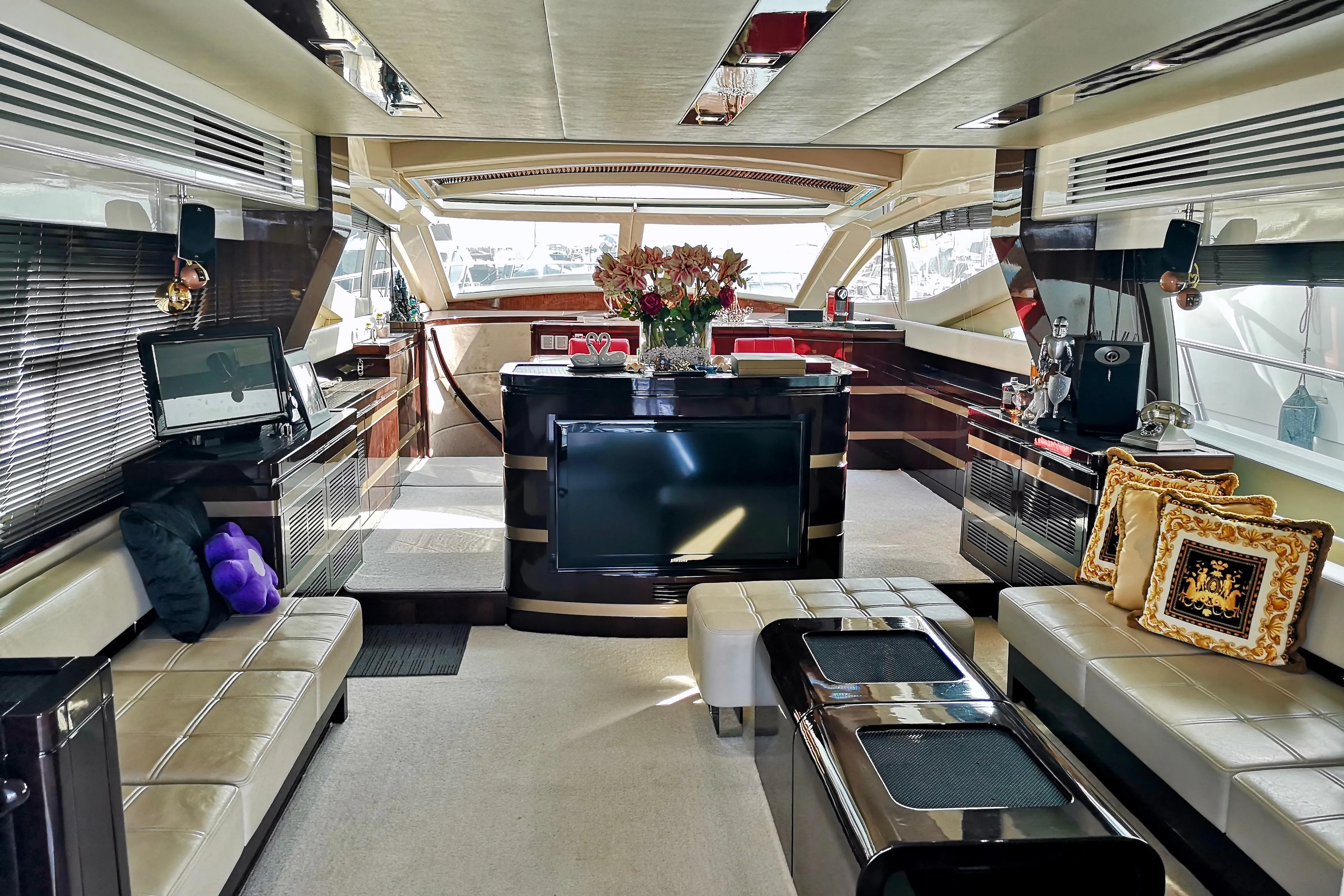 Luxurious interior of a 2012 Ruby 65s yacht with elegant seating and modern decor.