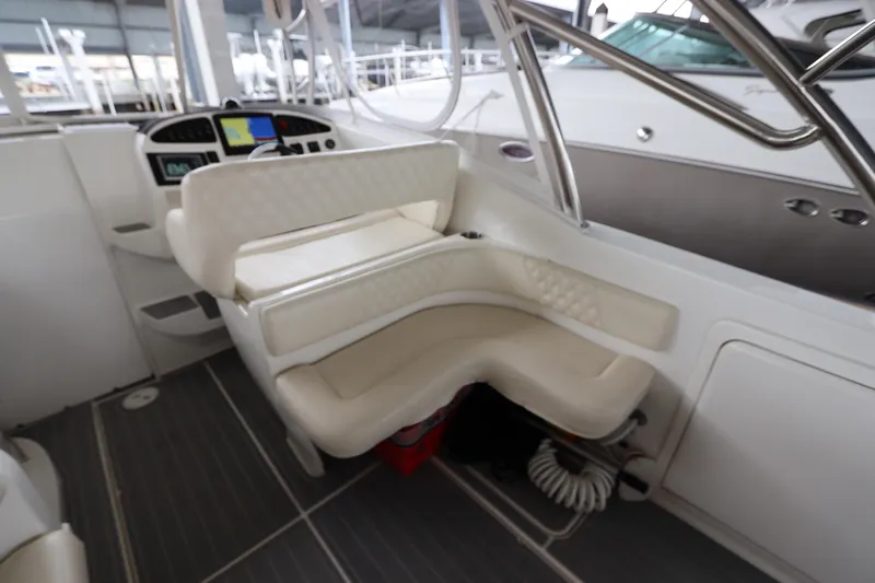  Yacht Photos Pics Interior of 2014 Intermarine 380 Sport boat with white seating and control panel.