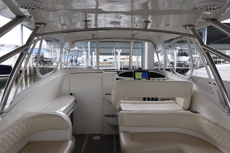  Yacht Photos Pics Interior of a 2014 Intermarine 380 Sport yacht with luxurious seating and navigation controls.