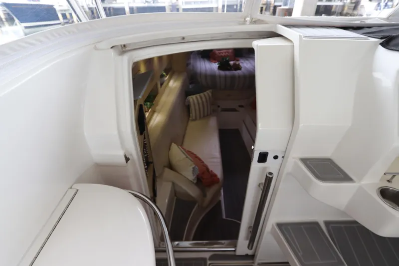  Yacht Photos Pics Interior view of 2014 Intermarine 380 Sport yacht, featuring cabin entrance and seating area.