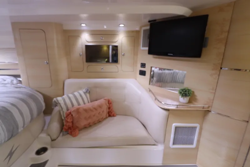  Yacht Photos Pics Luxurious 2014 Intermarine 380 Sport yacht interior with cozy seating, TV, and modern decor.