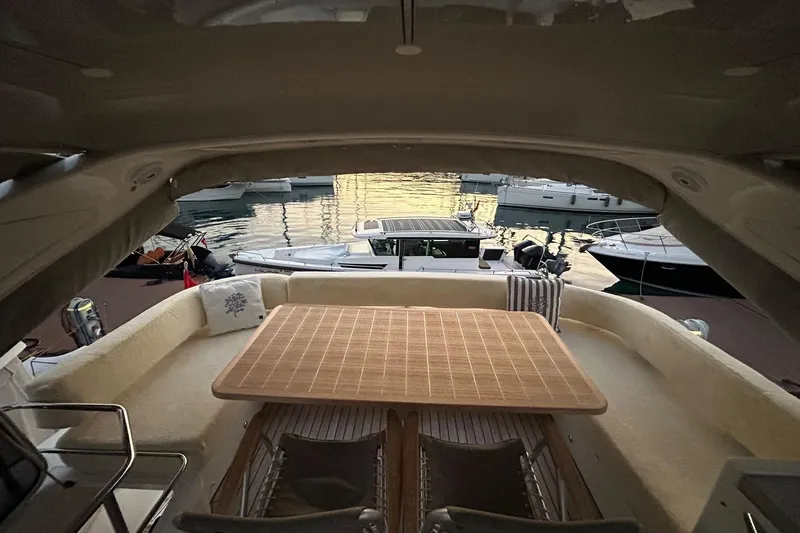 48 Navetta Yacht Photos Pics Luxurious 2019 Absolute NAVETTA 48 yacht interior with elegant seating and wooden table.
