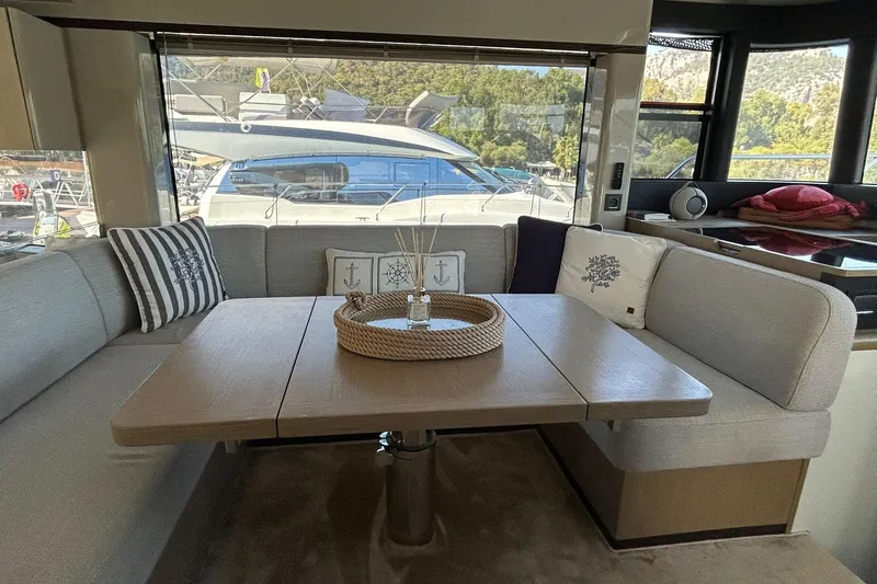 48 Navetta Yacht Photos Pics Luxurious interior of 2019 Absolute NAVETTA 48 yacht with elegant seating and decor.