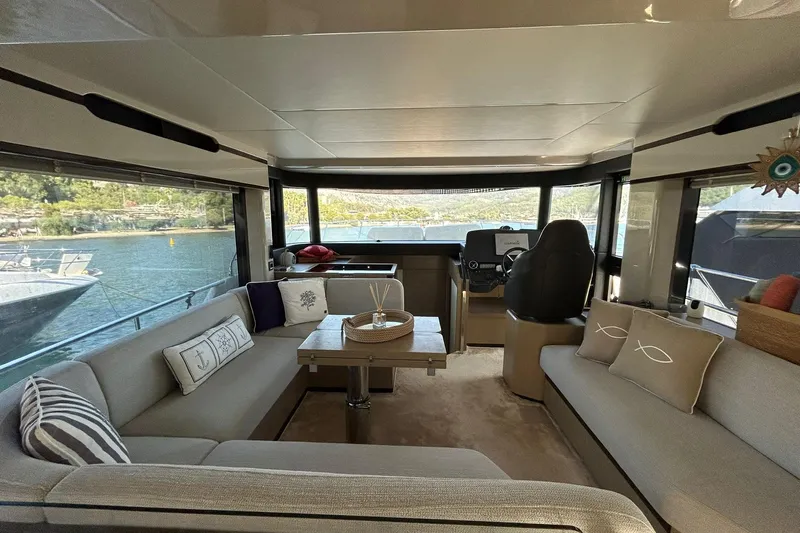48 Navetta Yacht Photos Pics Luxurious interior of 2019 Absolute NAVETTA 48 yacht with elegant seating and scenic views.