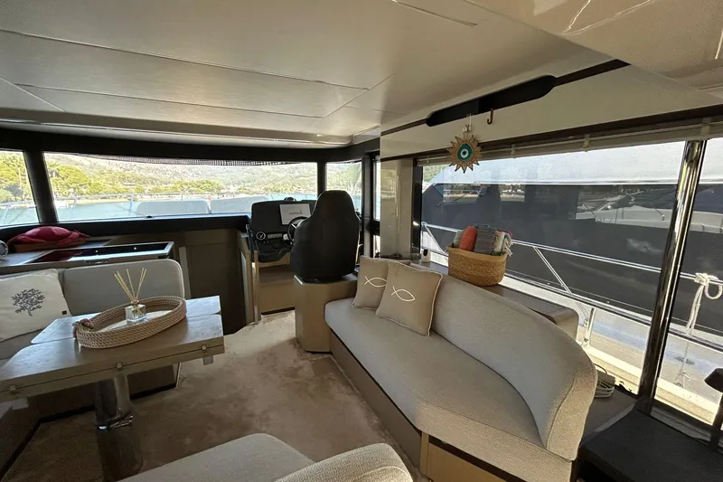 48 Navetta Yacht Photos Pics Luxurious interior of 2019 Absolute NAVETTA 48 yacht with elegant seating and decor.